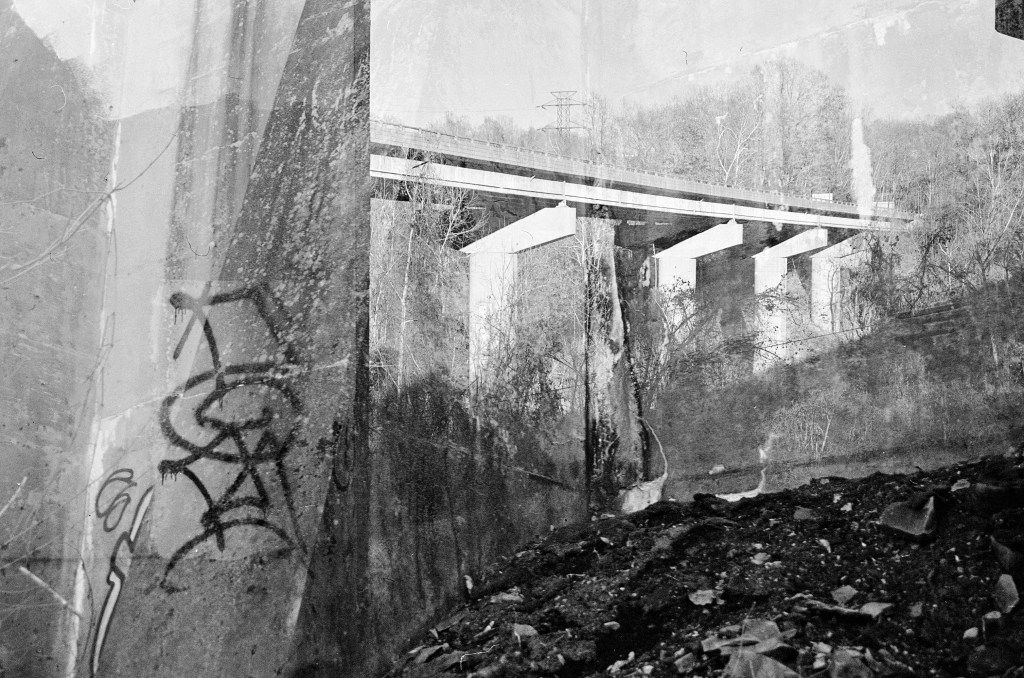Introductory image for website. A triple-exposure of the underside of a highway bridge. 